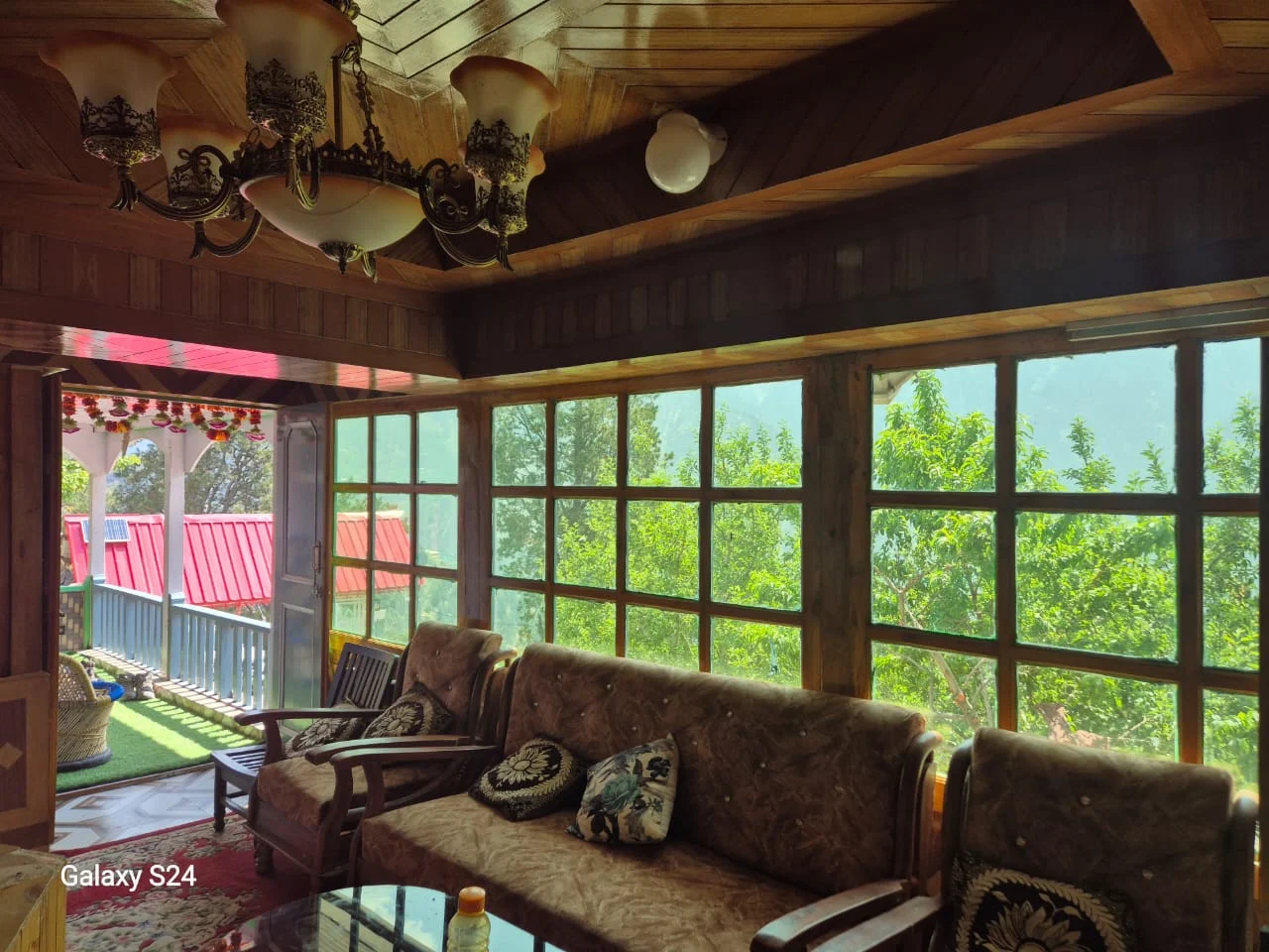 Wooden hall and lounge area of the homestay